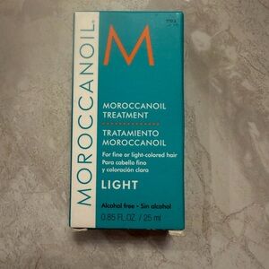 Moroccanoil Treatment in Turquoise and Black Bottle